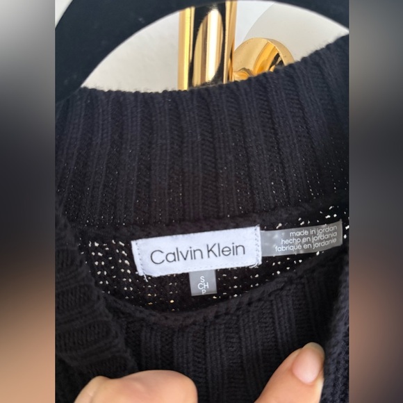 Calvin Klein black sweater vest layered over white long-sleeve button-down shirt - Picture 6 of 7